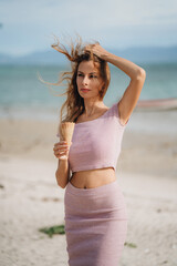 A portrait of blonde woman with ice cream