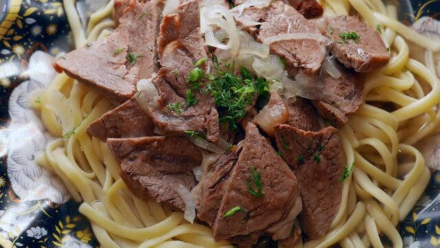Etnic Kazakh food - beshbarmak, meat with noodles