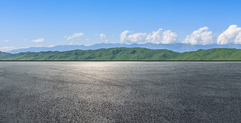 Empty asphalt road mountain under blue sky