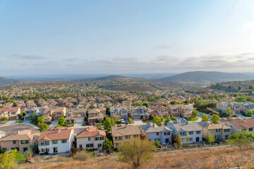 Fototapeta na wymiar Fenced community residences near the Double Peak Park at San Marcos, California