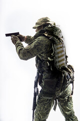 Members of the special purpose unit. A Russian special forces soldier with assault rifle aiming from a machine gun on a white background
