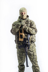 Members of the special purpose unit. A Russian special forces soldier with assault rifle aiming from a machine gun on a white background