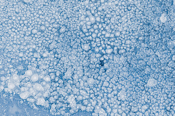 Ice texture background. Textured, blue-toned, the cold, frozen surface.
