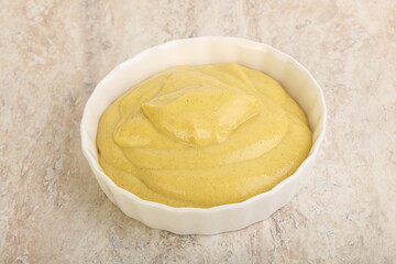 Organic mustard sauce in the bowl