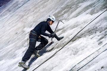 Man with ice ax on the glacier.
