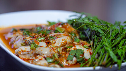 Thai food, Oyster Salad in a specialist dish with fresh vegetables.