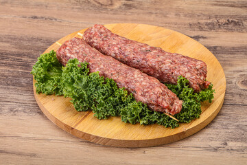 Raw minced beef kebab skewer