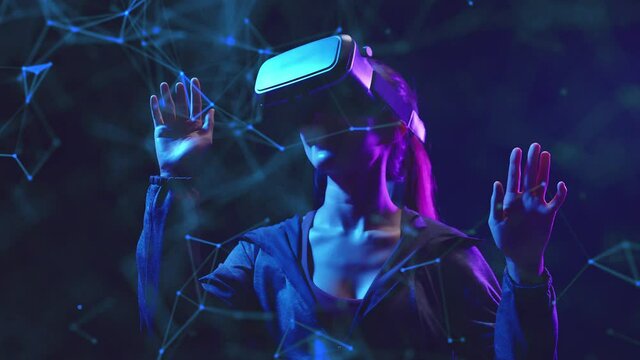 Metaverse VR virtual reality game playing, woman play metaverse virtual digital technology game control with VR goggle