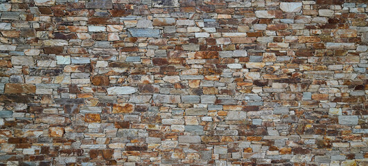 Stone web header old wall vintage texture panoramic large background brick siding different sized stones