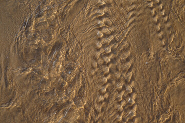 Sand pattern texture art low tide tropical beach water on sandy background