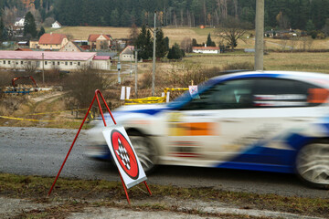 The rally racing car arriving to the finish line of the speed stage. 