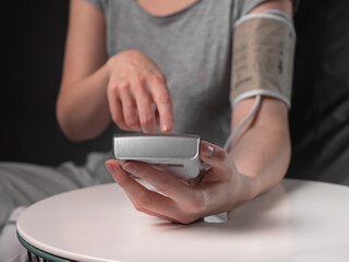 Blood pressure measuring and monitoring concept by young people.