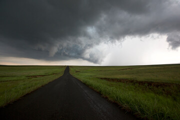 Fototapeta premium clouds over the road landscape