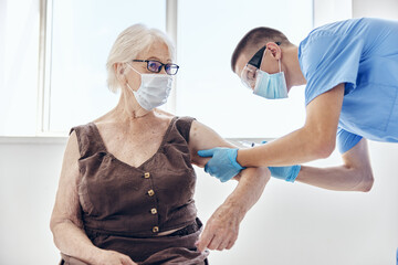 doctor with a syringe immunity protection patient treatment