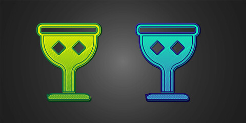 Green and blue Medieval goblet icon isolated on black background. Holy grail. Vector