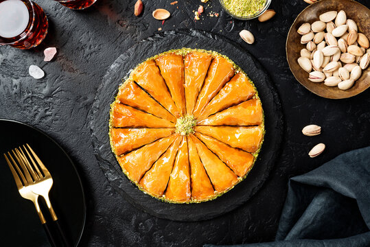 Traditional Turkish  Dessert Baklava With Pistachio Served With Black Turkish Tea. Top View
