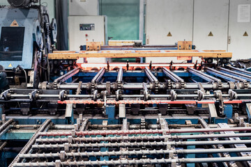 Manufacturing of metal screws in an induction furnace. Industrial production of metal products....
