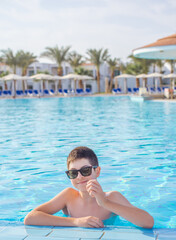 Boy rest in vacation. Teenage boy in swimming pool, Children lifestyle. Enjoy the life