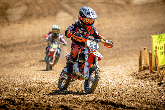 kid motocross rider on a motorcycle in action