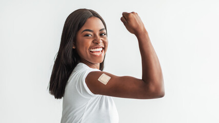 Black Vaccinated Female Showing Shoulder With Patch And Biceps