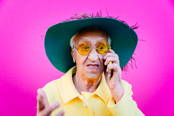 Funny grandmother portraits. Senior old woman, interacting with a smartphone. Concept about...