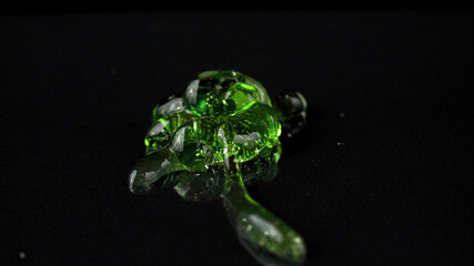 Close-up photo of squeezed green transparent balm