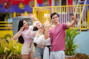 group of friend are happy and fun together at amusement theme park, outdoor activity