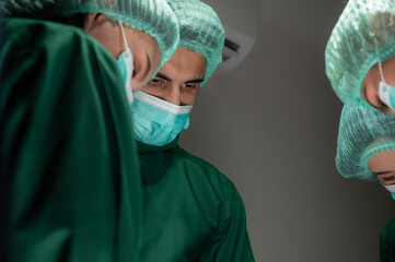 professional surgeon doctor team are working for surgery in medical operating room at hospital
