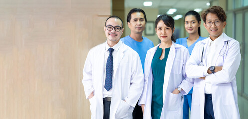 Group of asian doctors looking at camera. Mixed race professional medical doctor and nurse meeting.