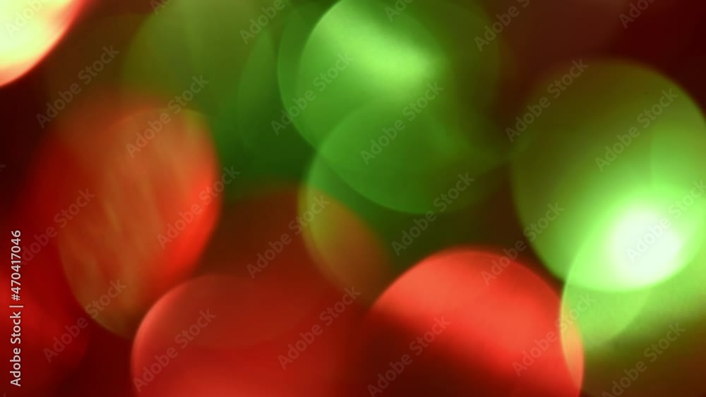 Canvas Prints green and red christmas bokeh moves.large bright bokeh of traditional new year colors moving from le