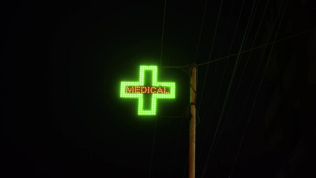 Pharmacy neon sign at night