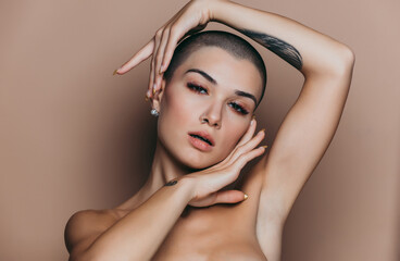 Modern beauty portrait. Young woman with shaved head