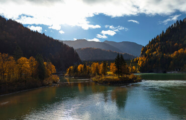 beautiful lake view in autumn, with a wooden bench