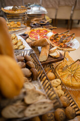 assorted bread basket on the buffet table