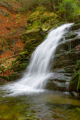 Waterfall in Obidza, late autumn, Beskid Sadecki mountain range in Carpathian Mountains, Poland.