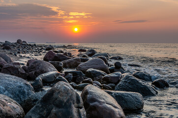 Baltic sea coast, beach and cliffs at Gdynia Orlowo during sunrise, Poland