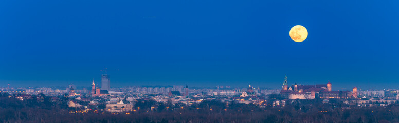Naklejka premium Moonrise over Wawel castle in Krakow, Poland