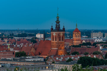 Obraz premium Gdansk, Poland, evening view of the historical city center with St Catherine and St John churches