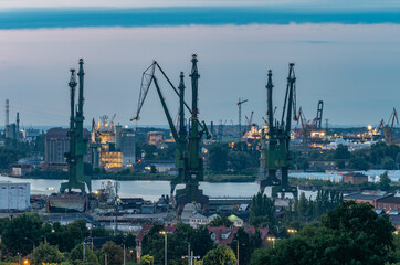 Obraz premium Gdansk, Poland, industrial district including Gdansk Shipyard, large shipbuilding cranes