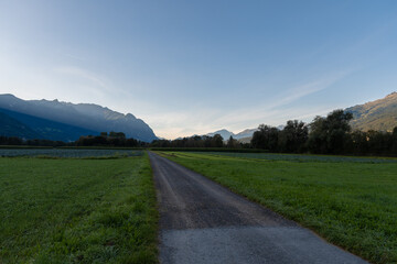 Fototapeta na wymiar Schaan, Liechtenstein, September 25, 2021 Green field just before sunrise