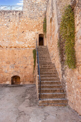 Fototapeta na wymiar Niebla, Spain - November 18, 2021: Stairs to go up to the towers or turrets in defensive walls of Niebla castle, in Huelva, Andalucia, Spain