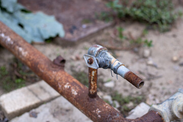 Fototapeta premium Rusty iron plumbing faucet. Old plumbing.