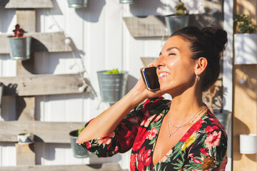 Young woman talking on the mobile phone