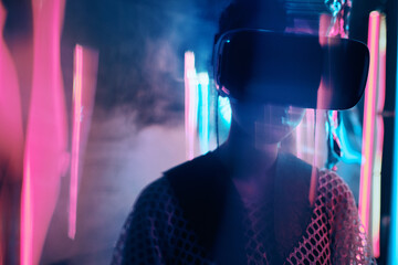 Neon lgiht portrait of girl in VR glasses