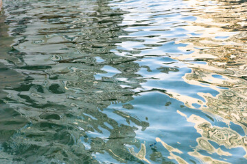Light reflected on the water surface. Abstract blue water. Water surface, ocean background