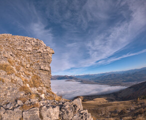 rock with see of cloud shot during a hike in peak of Gleize, Champsaur, french alps