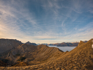 Fototapeta premium light sunset with a cloud of sea shot during a hike in peak of Gleize, Champsaur, french alps