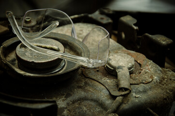 protective glasses on rusty metal surface