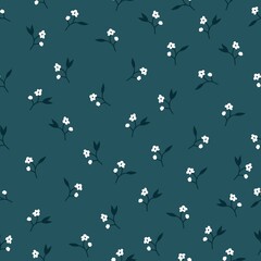 Seamless vintage pattern. Small white flowers on a dark blue background. vector texture. fashionable print for textiles and wallpaper.