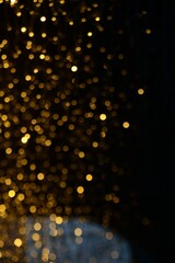 Fototapeta na wymiar Golden christmas lights blur background 